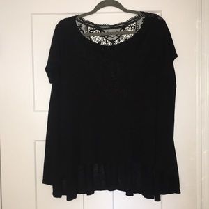 Black top with lace detailing on the back